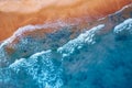 Concept summer sunny travel image. Turquoise water with wave with sand beach background from aerial top view Royalty Free Stock Photo