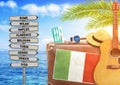 Concept of summer traveling with old suitcase and Italy town sign