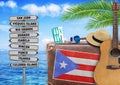Concept of summer traveling with old suitcase and Puerto Rico town sign