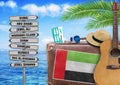 Concept of summer traveling with old suitcase and United Arab Emirates