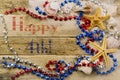Concept for summer United States holiday of fourth of July on the beach with shells, starfish and sand with message Royalty Free Stock Photo