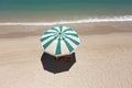 The concept of summer vacation. Top view on a sun lounger under an umbrella on the sandy beach Royalty Free Stock Photo