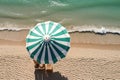 The concept of summer vacation. Top view on a sun lounger under an umbrella on the sandy beach Royalty Free Stock Photo