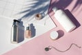 Concept suncreen Summer pink cosmetics flat lay . Top view