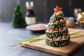 Sushi on a wooden plate in the form of a Christmas tree with copy space Royalty Free Stock Photo