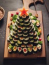 Sushi on a wooden plate in the form of a Christmas tree Royalty Free Stock Photo