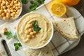Concept of tasty eat with bowl of hummus, top view