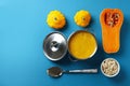 Concept of tasty food with pumpkin soup on blue background Royalty Free Stock Photo