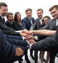 Large group of business people standing with folded hands together Royalty Free Stock Photo