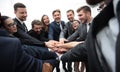 Large group of business people standing with folded hands together Royalty Free Stock Photo