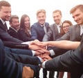 Large group of business people standing with folded hands together Royalty Free Stock Photo