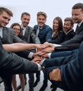 Large group of business people standing with folded hands together Royalty Free Stock Photo