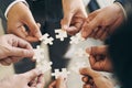 The concept of teamwork and partnership. Businessman's hands putting together puzzle pieces Royalty Free Stock Photo