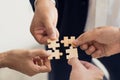 The concept of teamwork and partnership. Businessman's hands putting together puzzle pieces Royalty Free Stock Photo