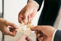 The concept of teamwork and partnership. Businessman's hands putting together puzzle pieces in the office Royalty Free Stock Photo
