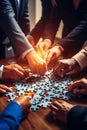 Concept of teamwork and partnership. Hands join puzzle pieces in the office. business people putting the jigsaws team Royalty Free Stock Photo