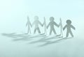 Concept of teamwork.team paper men standing Royalty Free Stock Photo