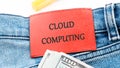 The concept of technology and development. Phrase, words, text CLOUD COMPUTING on the leather label of jeans Royalty Free Stock Photo