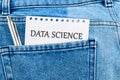 The concept of technology and development. Phrase, words, text DATA SCIENCE API It's written on a piece of paper in