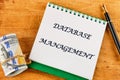 The concept of technology and development. Phrase, words, text DATABASE MANAGEMENT close-up