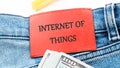 The concept of technology and development. Phrase, words, text INTERNET OF THINGS on the leather label of jeans Royalty Free Stock Photo