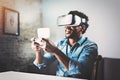 Concept of technology,gaming,entertainment and people.African man enjoying virtual reality glasses while relaxing in Royalty Free Stock Photo