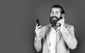 concept of technology progress. Then and Now. mature bearded man talk on retro phone. male hold smartphone. compare Royalty Free Stock Photo