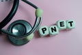 Concept of text PNET - Primitive Neuroectodermal Tumor on wooden blocks. medical or healthcare concept Royalty Free Stock Photo