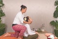 Concept thai Massage. Asian young woman getting herbal massage thai massage in spa salon.Thai girl reflexology on