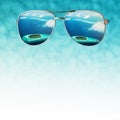 Concept on the theme of leisure and travel with sunglasses and the islands reflected in them Royalty Free Stock Photo