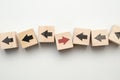 Concept of think differently - wooden cubes with arrows Royalty Free Stock Photo