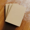 Concept of three blank notebook with brown craft paper cover on wooden desk.Closeup empty horizontal mockup.Top view. 3d