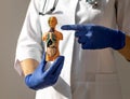 Concept of thyroid and trachea diseases. Endocrinologist with human 3d model body in hands Royalty Free Stock Photo