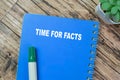 Concept of Time For Facts write on book isolated on Wooden Table