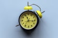 Concept of time management, deadline, work pressure. Alarm clock on blue background Royalty Free Stock Photo