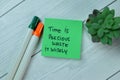 Concept of Time is Precious Waste It Wisely write on sticky notes isolated on Wooden Table Royalty Free Stock Photo