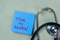 Concept of Time To Renew write on sticky notes with stethoscope isolated on Wooden Table Royalty Free Stock Photo