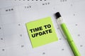 Concept of Time to Update write on sticky notes and calendar isolated on Wooden Table Royalty Free Stock Photo