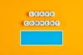 Concept of to leave a comment or to give feedback. The word leave comment on wooden cubes with a blank text box