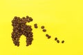 Concept tooth of coffee grains collapses under the influence of coffee