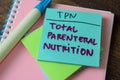 Concept of TPN - Total Parenteral Nutrition write on sticky notes isolated on white background Royalty Free Stock Photo