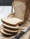 Bread. loaf of freshly baked bread with knife on cutting board. Artisan bread with seeds on table.Rustic sourdough bread Royalty Free Stock Photo