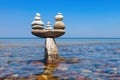 Concept of tranquility and balance. Rock zen in the form of scales. Royalty Free Stock Photo