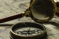 Retro compass with old map and magnifier Royalty Free Stock Photo