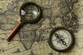 Retro compass with old map and magnifier Royalty Free Stock Photo
