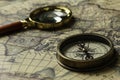 Retro compass with old map and magnifier Royalty Free Stock Photo