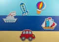 Concept of travel by land sea and air on a yellow-blue background of children`s toys Royalty Free Stock Photo