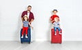 Concept travel and tourism. happy family with suitcases near w Royalty Free Stock Photo