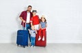 Concept travel and tourism. happy family with suitcases near w Royalty Free Stock Photo