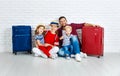 Concept travel and tourism. happy family with suitcases near w Royalty Free Stock Photo